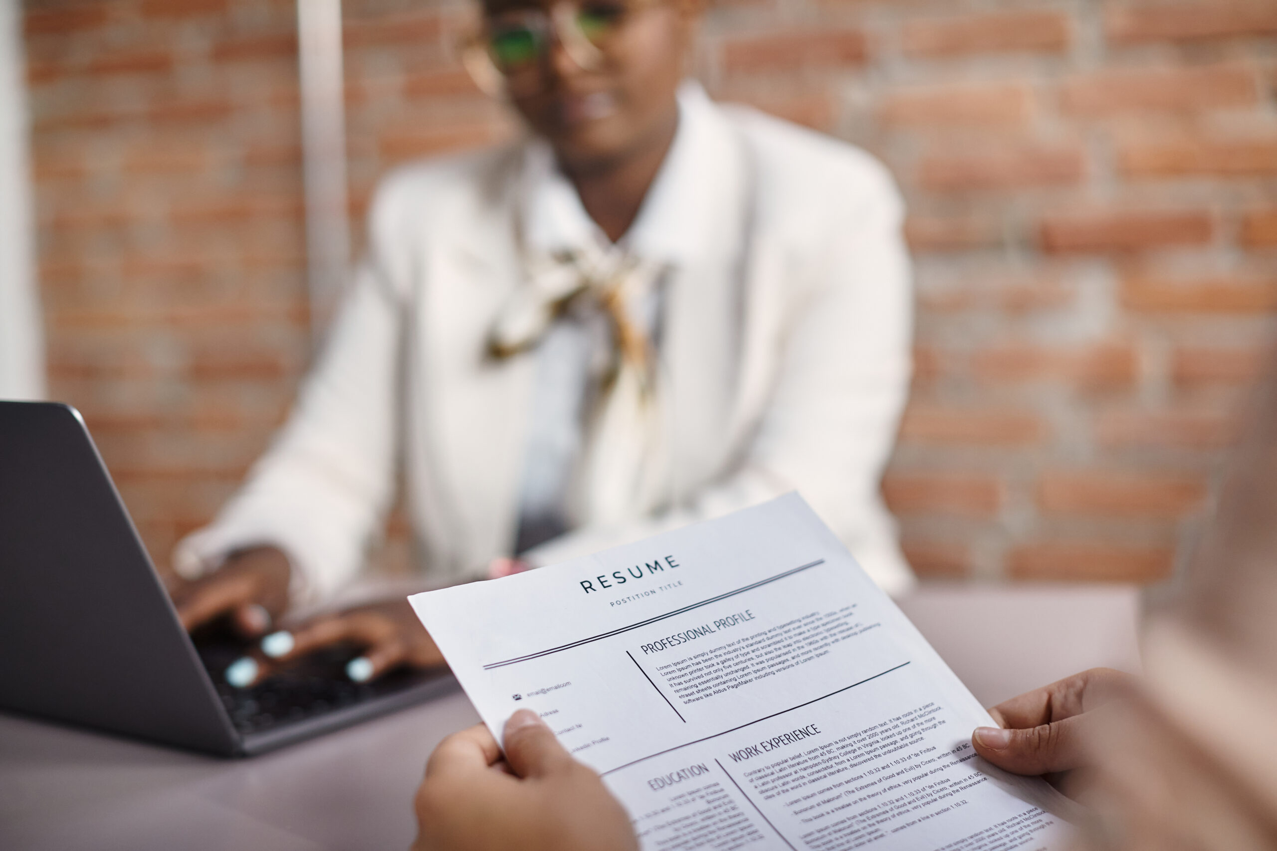 A job applicant about to present her resume to the hiring manager.